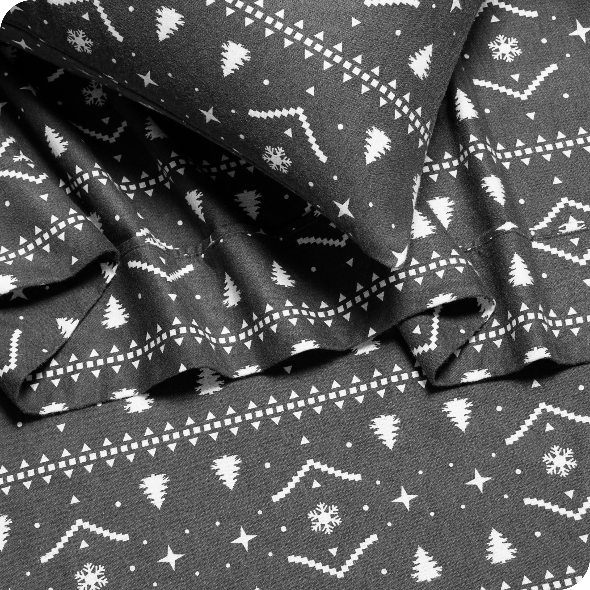 Close up of matching flannel print sheets and pillowcases