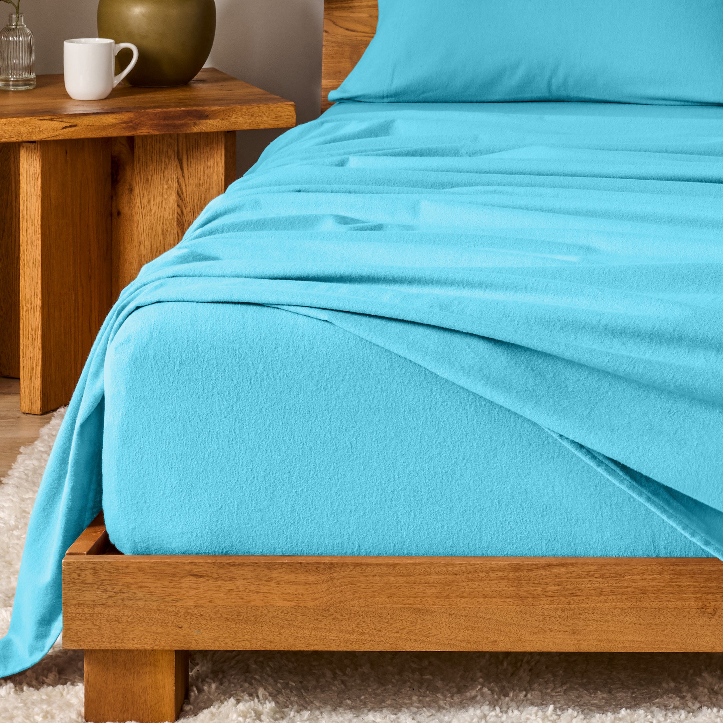 A modern bedroom with cotton flannel sheets on the bed
