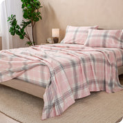 A bed made with cotton flannel sheets