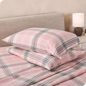 Printed flannel pillowcases and sheets on a bed