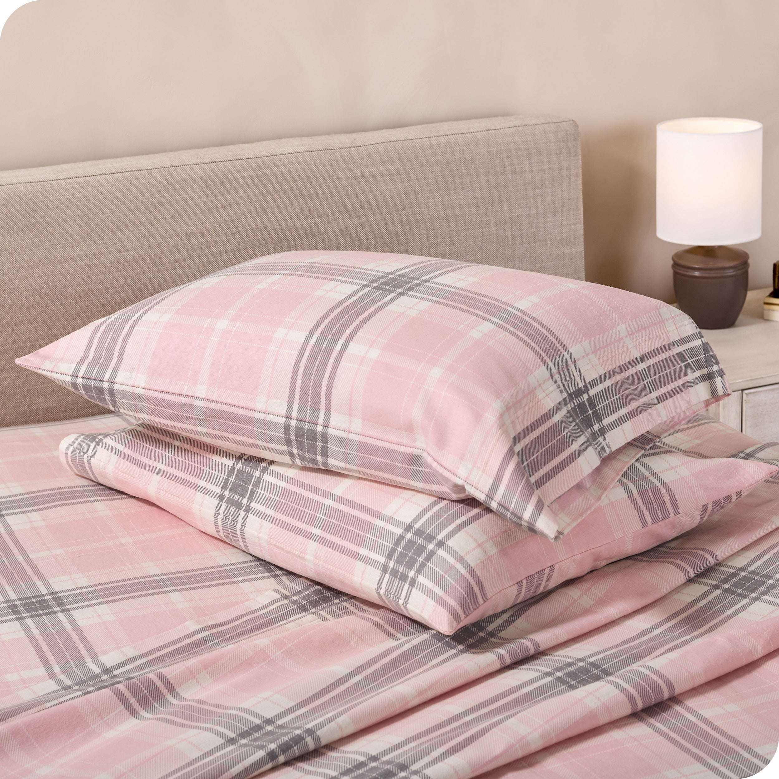 Printed flannel pillowcases and sheets on a bed