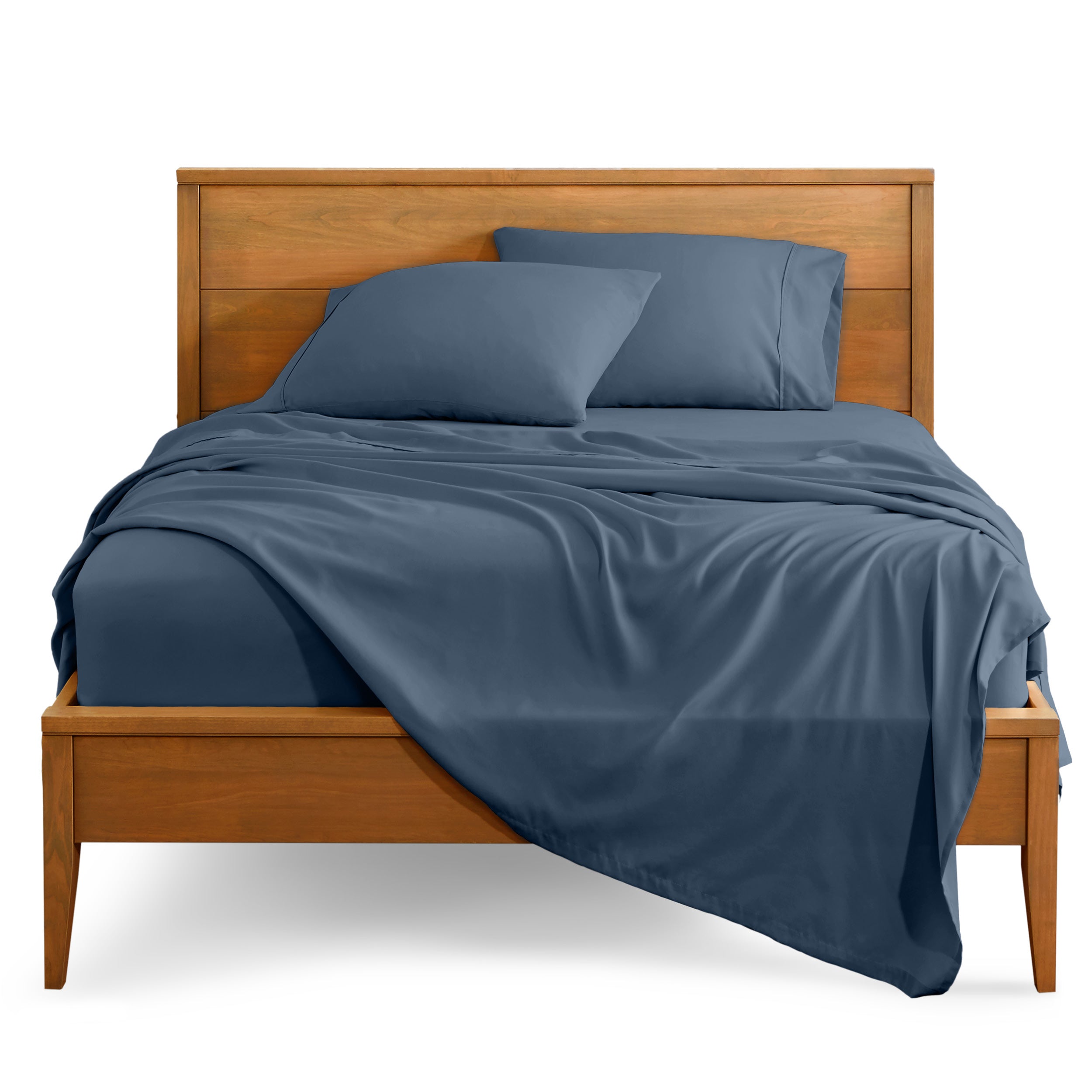 Microfiber sheet set on a bed with a wooden bed frame