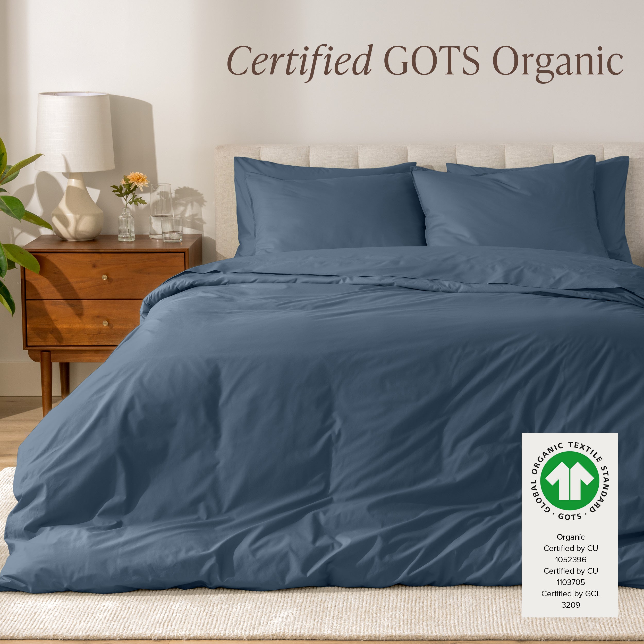 A modern bed with a organic cotton percale duvet cover on, it's Certified GOTS Organic.