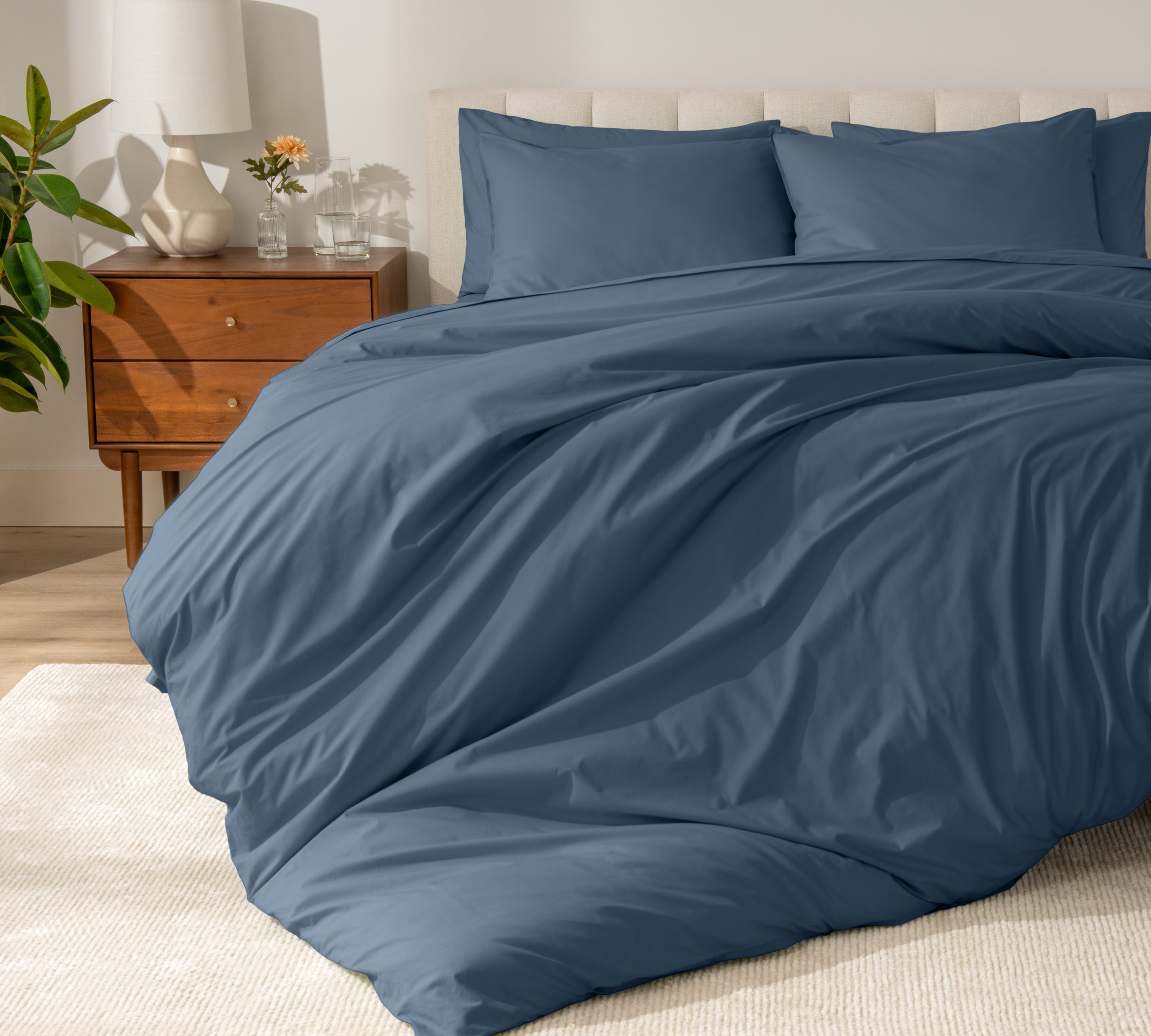 A modern bed with a organic cotton percale duvet cover on.