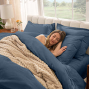 A women sleep on the bed with organic cotton percale duvet cover and pillowcases.