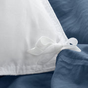 Close up of cloth ties for attaching duvet insert to inside of duvet cover
