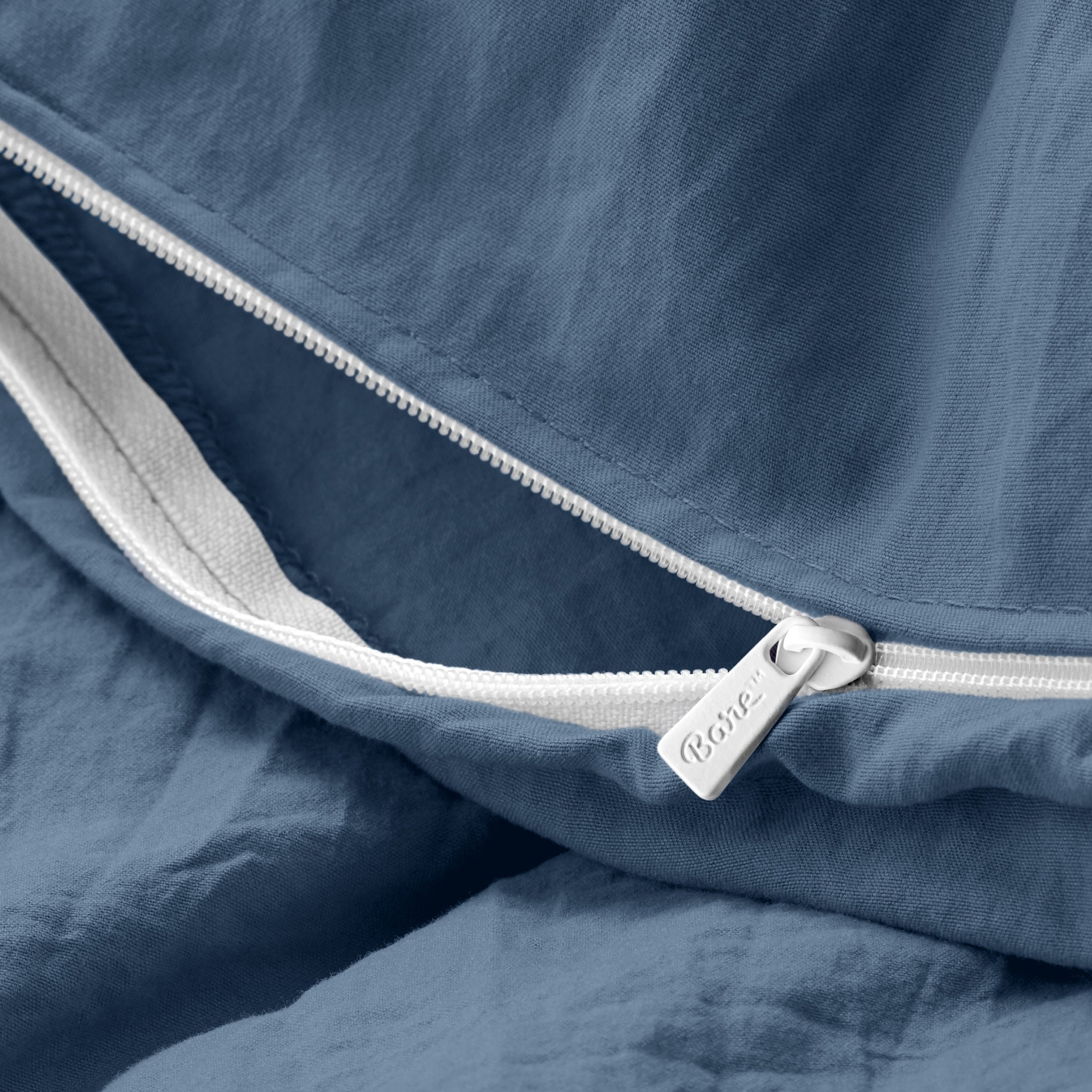 Close up of the zipper on the duvet cover partially opened