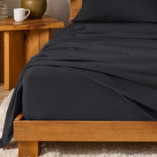 A modern bedroom with cotton flannel sheets on the bed