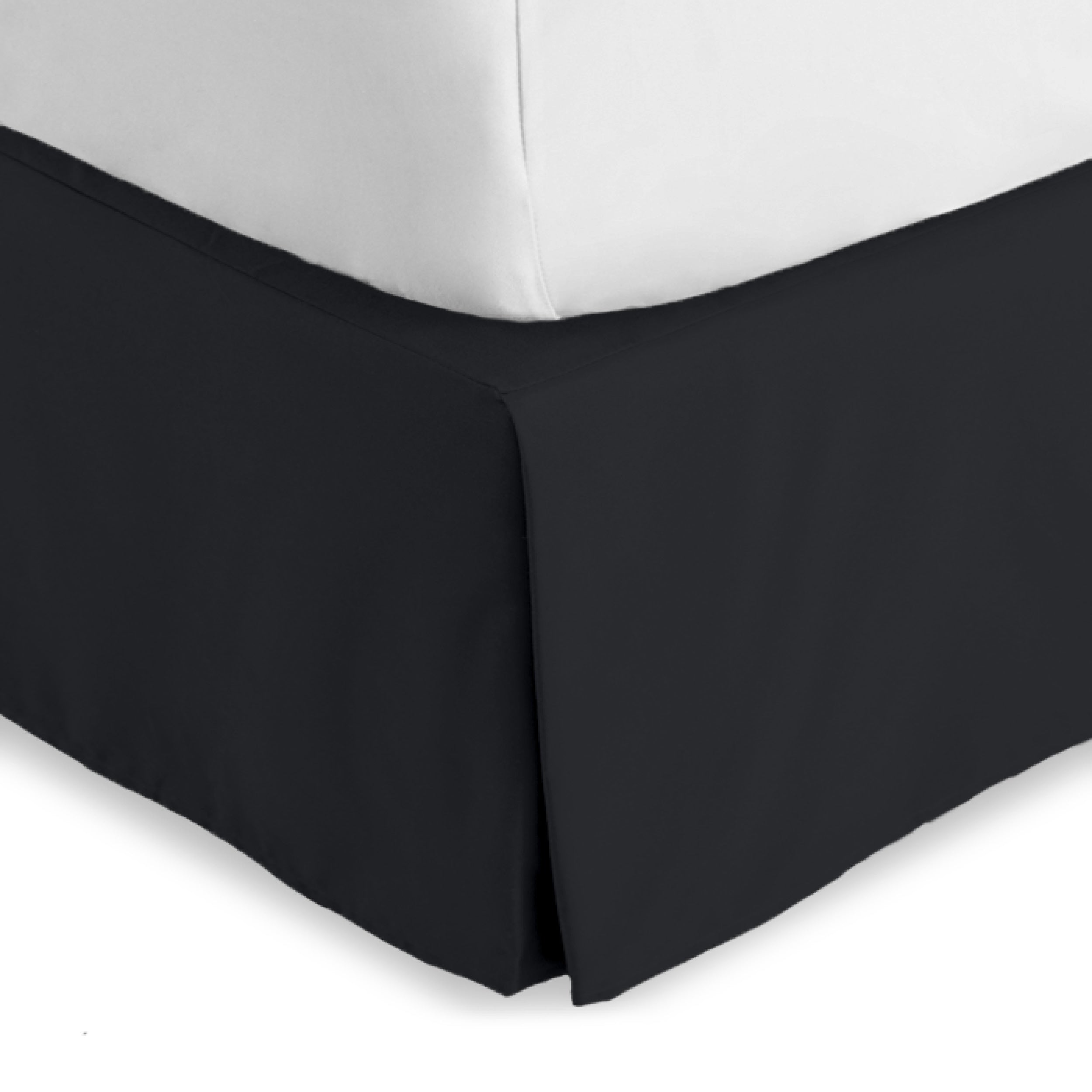 The corner of a bed skirt on a bed frame