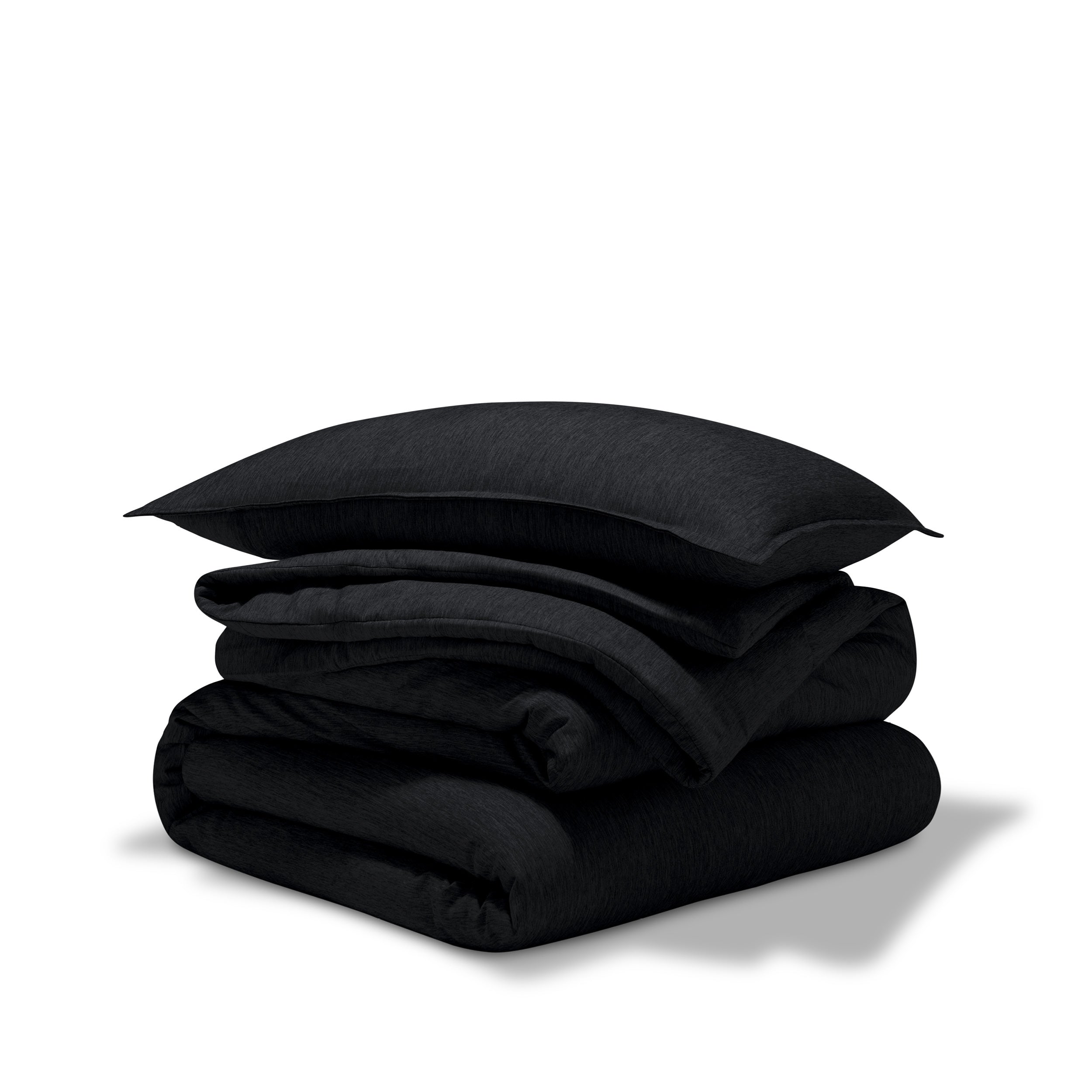 A comforter folded with a matching pillow sham stacked on top