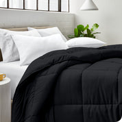 A bed made with pillows and a comforter