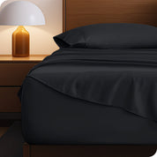 A cozy bedroom with a bed covered in soft microfiber sheets