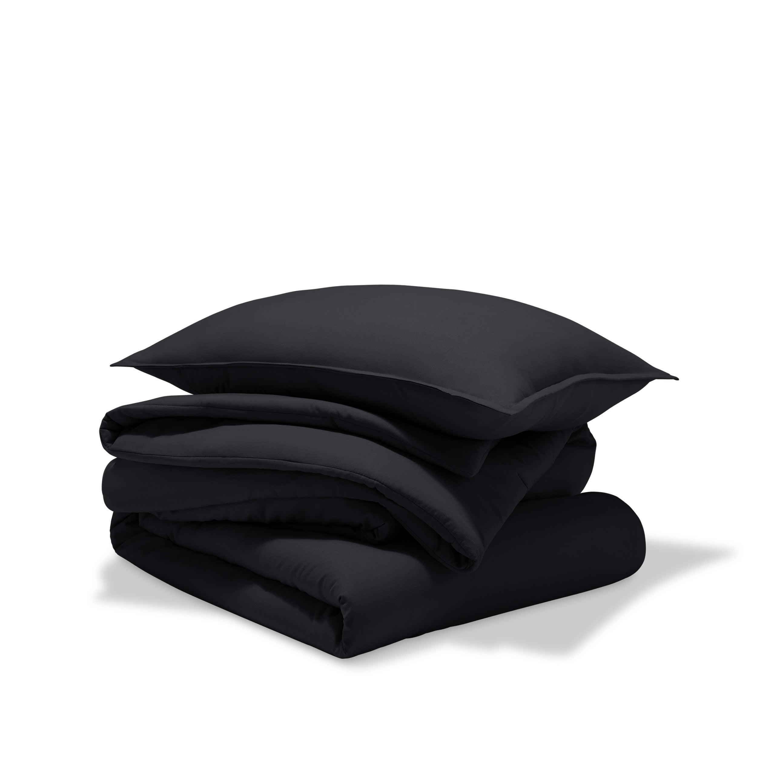 A comforter folded with a matching pillow sham stacked on top