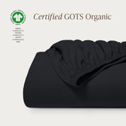 A single certified GOTS organic cotton fitted sheet folded