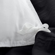 Close up of cloth ties for attaching duvet insert to inside of duvet cover