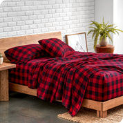 Plaid flannel sheets on a bed