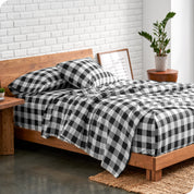Plaid flannel sheets on a bed