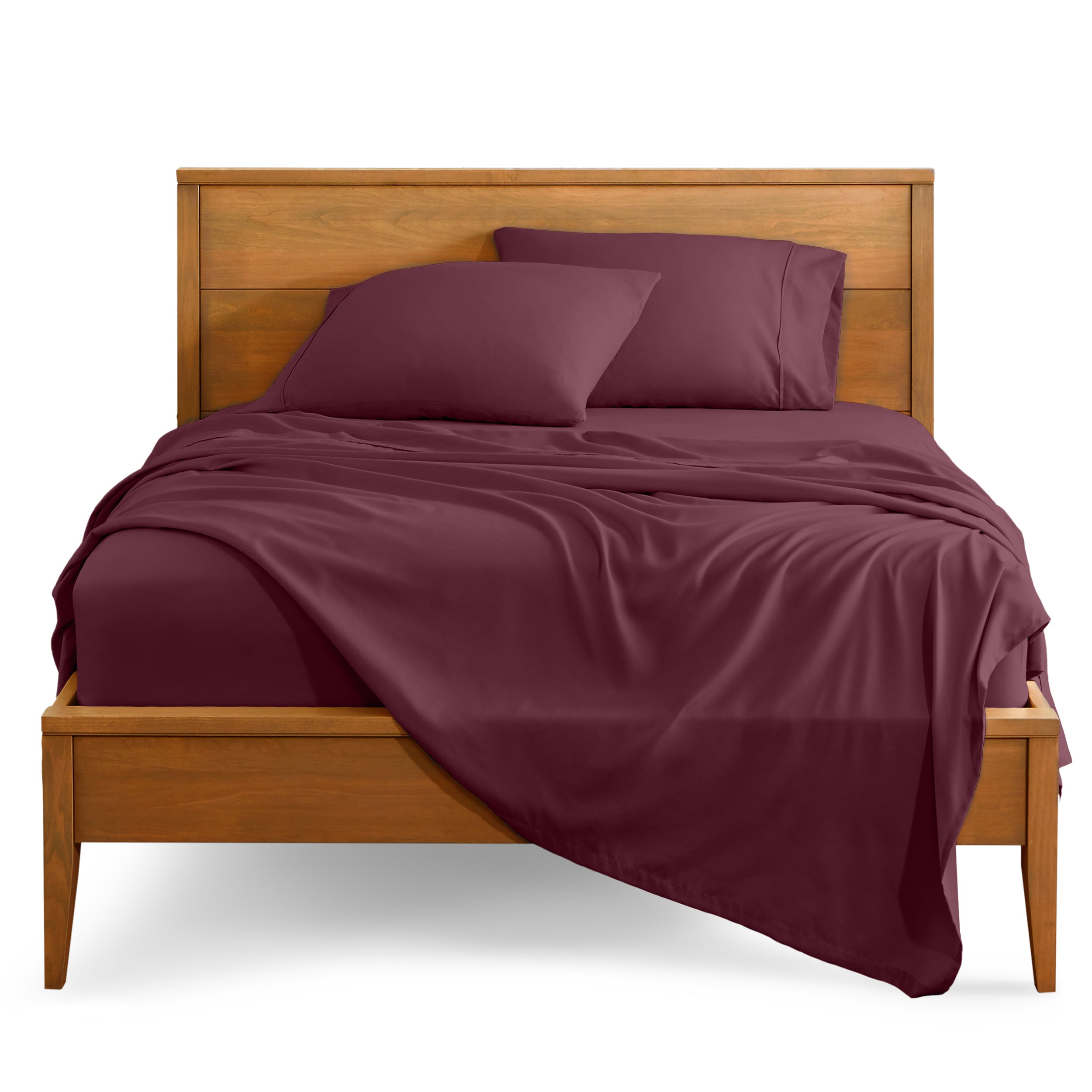 Microfiber sheet set on a bed with a wooden bed frame