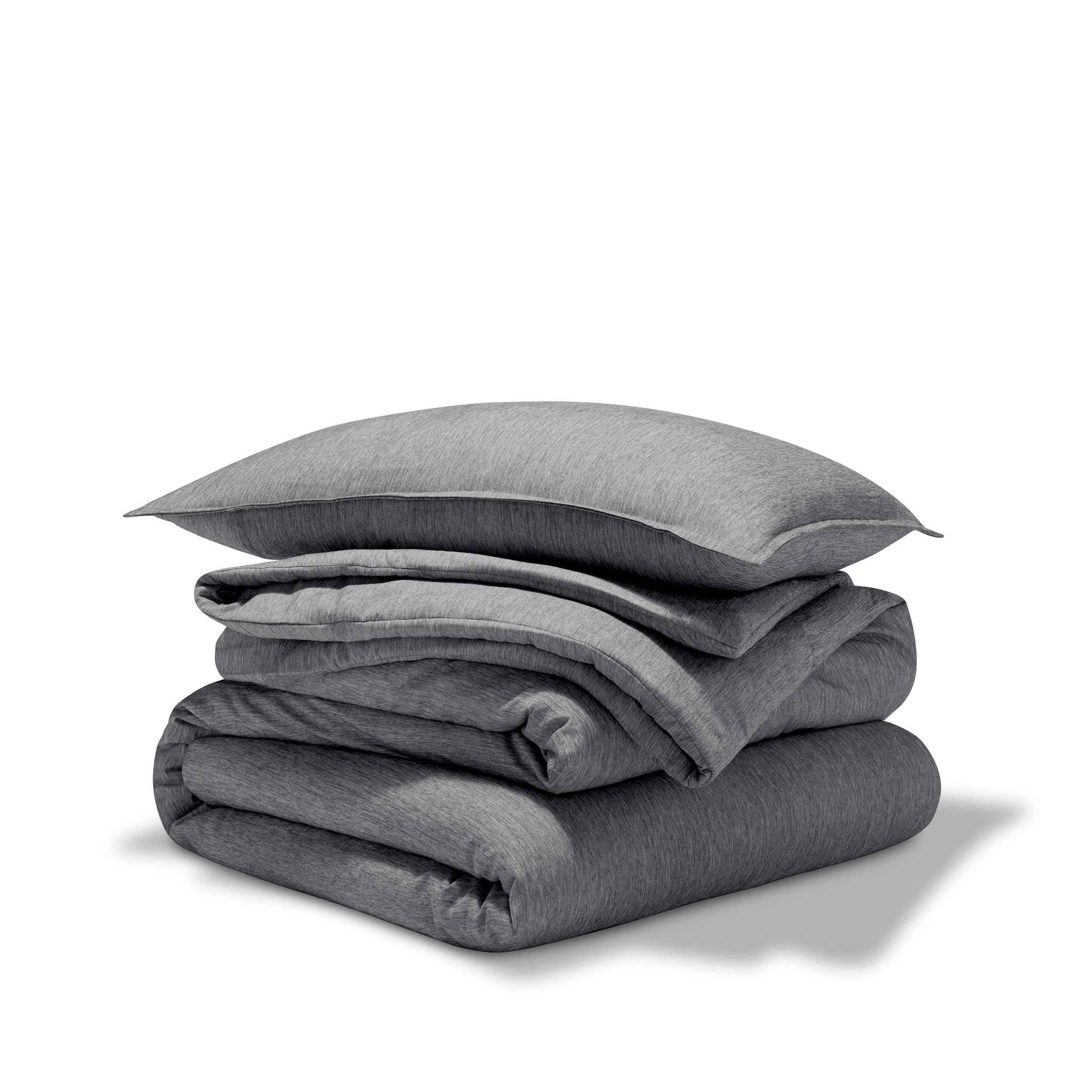 A comforter folded with a matching pillow sham stacked on top