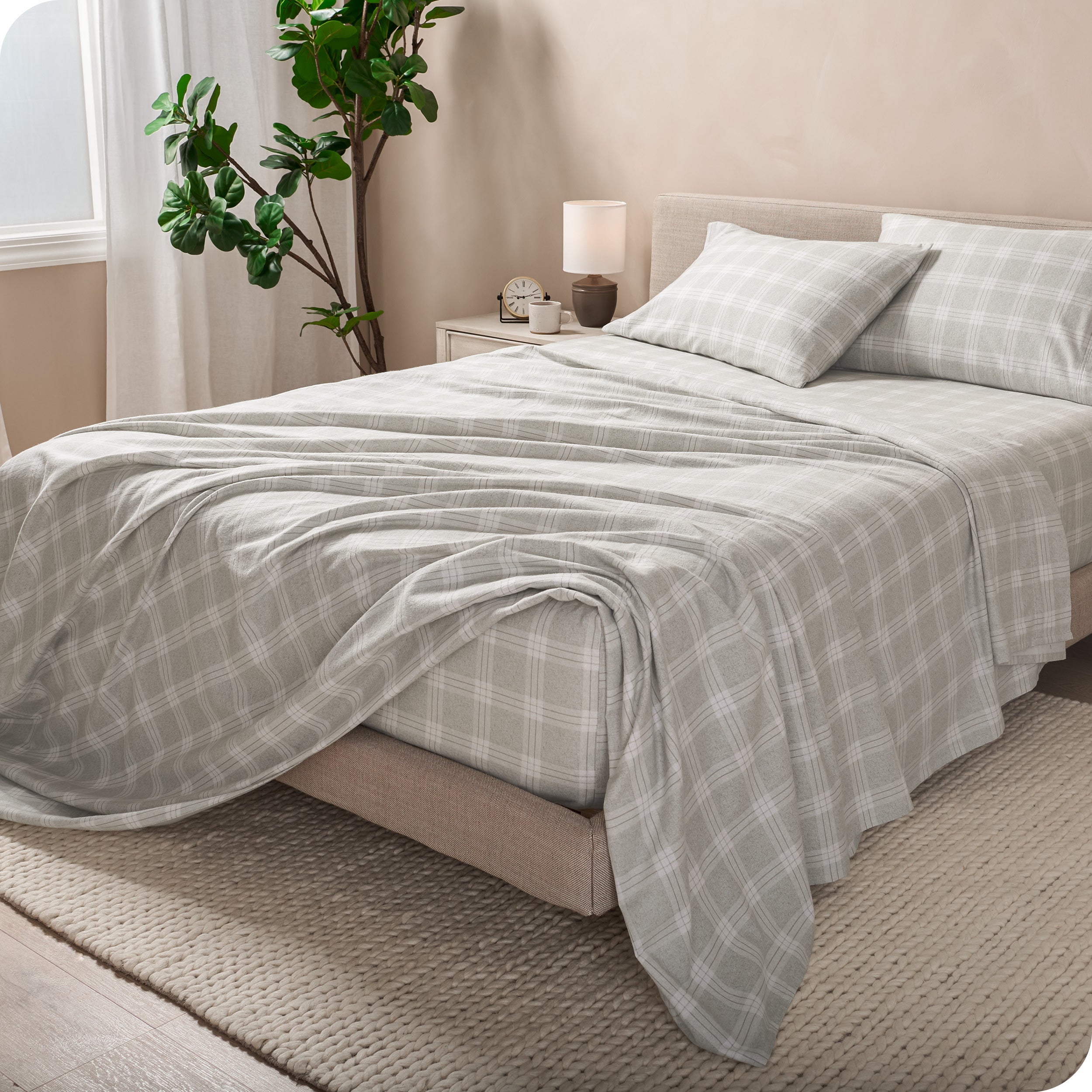 A bed made with cotton flannel sheets