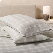 Printed flannel pillowcases and sheets on a bed