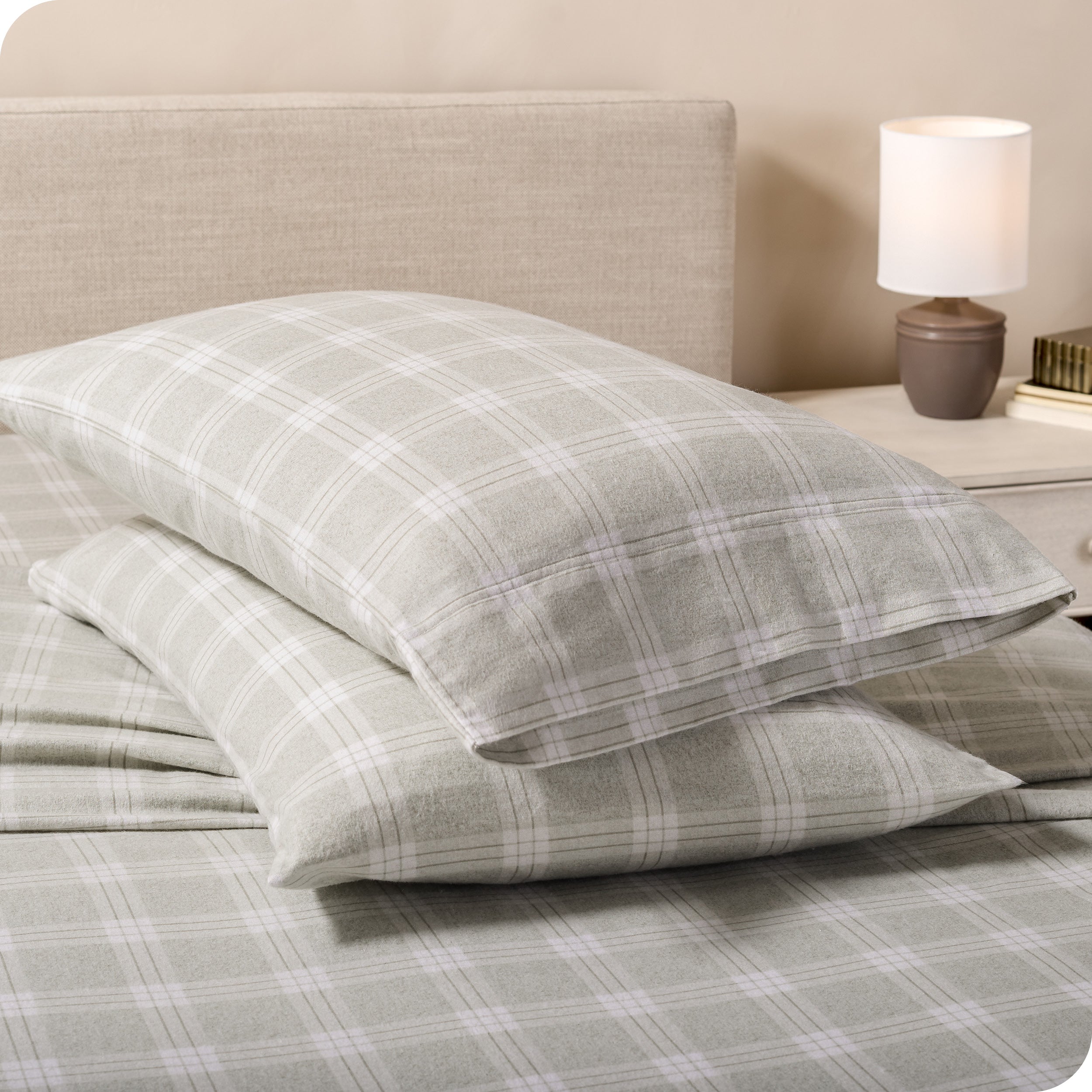 Printed flannel pillowcases and sheets on a bed