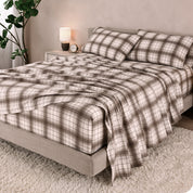 A bed made with cotton flannel sheets