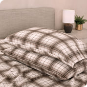 Printed flannel pillowcases and sheets on a bed