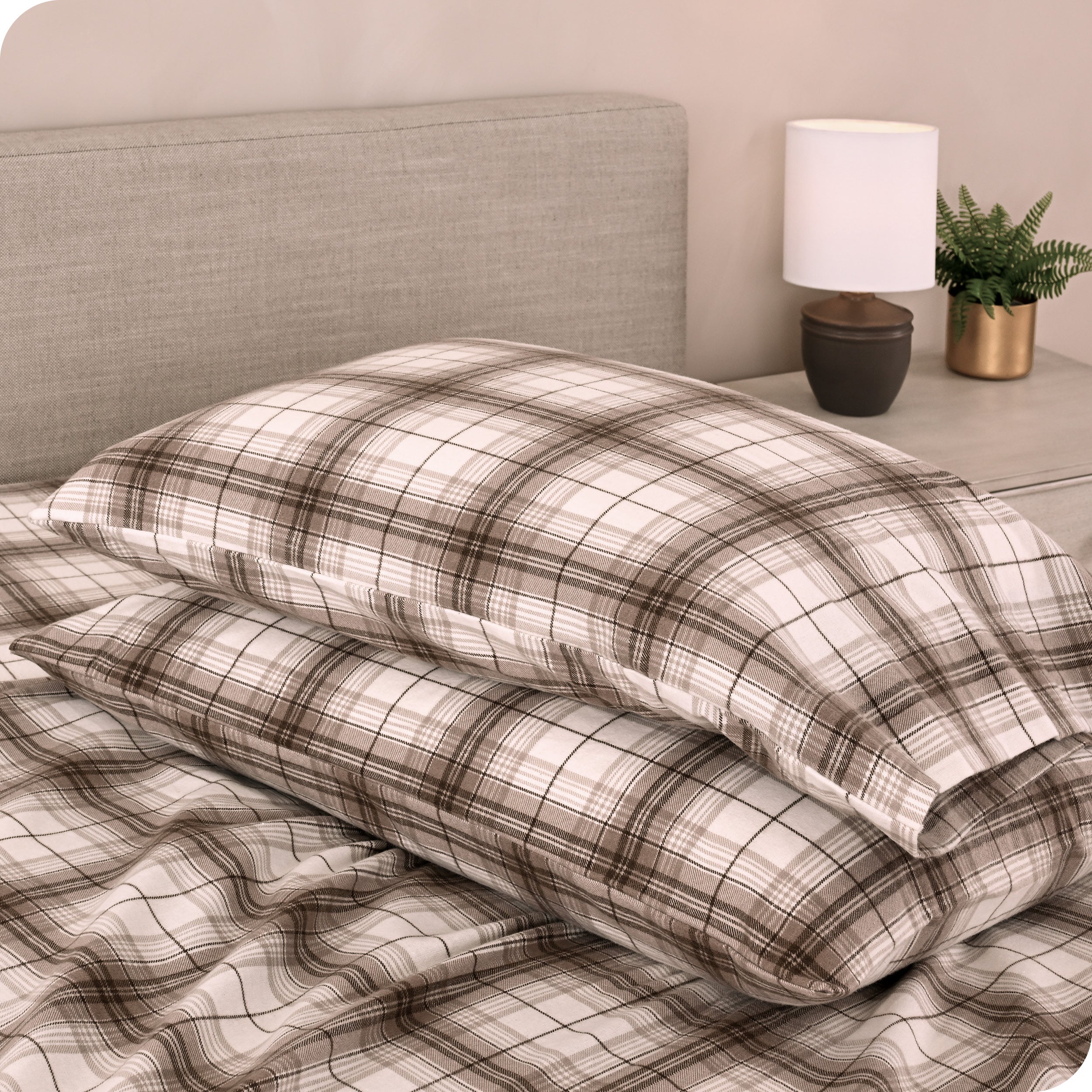 Printed flannel pillowcases and sheets on a bed