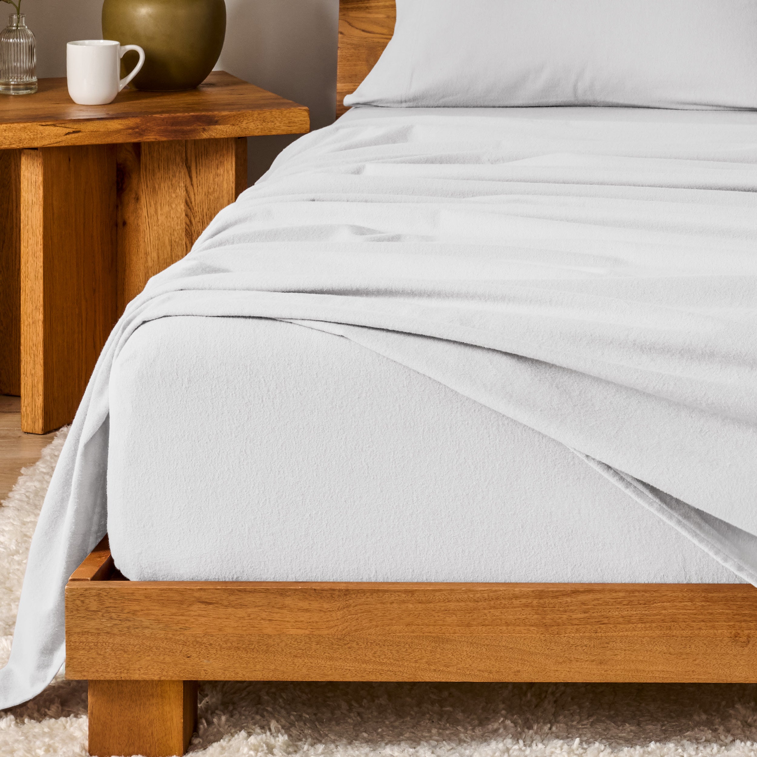 A modern bedroom with cotton flannel sheets on the bed