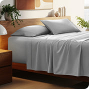 A cozy bedroom featuring a neatly made bed with soft, microfiber sheets