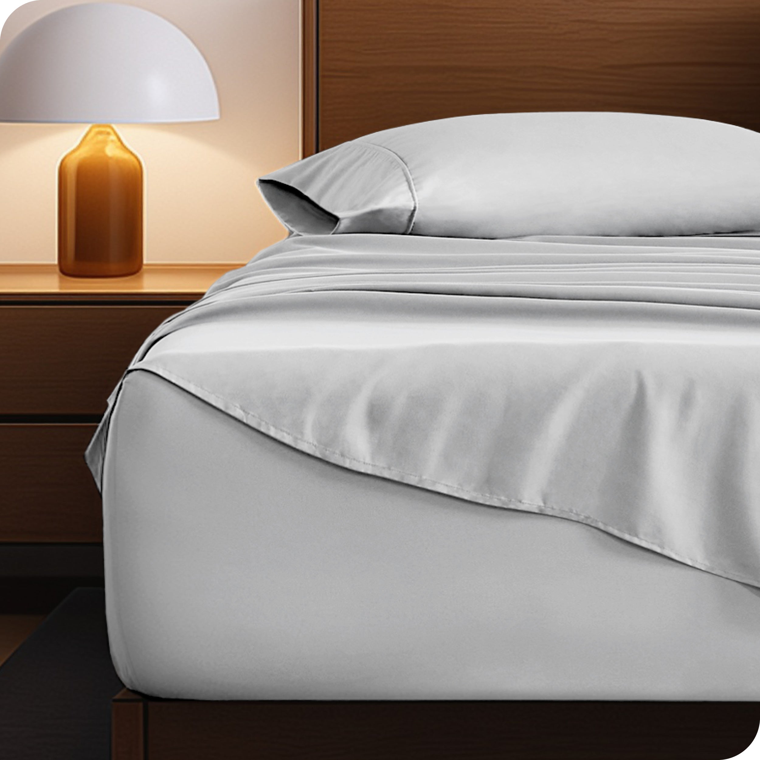 A cozy bedroom with a bed covered in soft microfiber sheets
