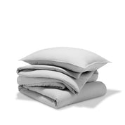 A comforter folded with a matching pillow sham stacked on top
