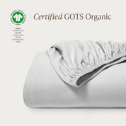 A single certified GOTS organic cotton fitted sheet folded