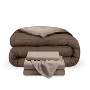 A reversible microfiber comforter and a coordinating sheet set folded and stacked