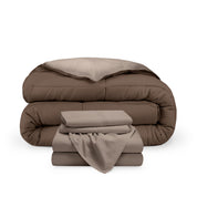 A reversible microfiber comforter and a coordinating sheet set folded and stacked