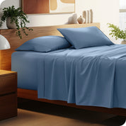 A cozy bedroom featuring a neatly made bed with soft, microfiber sheets