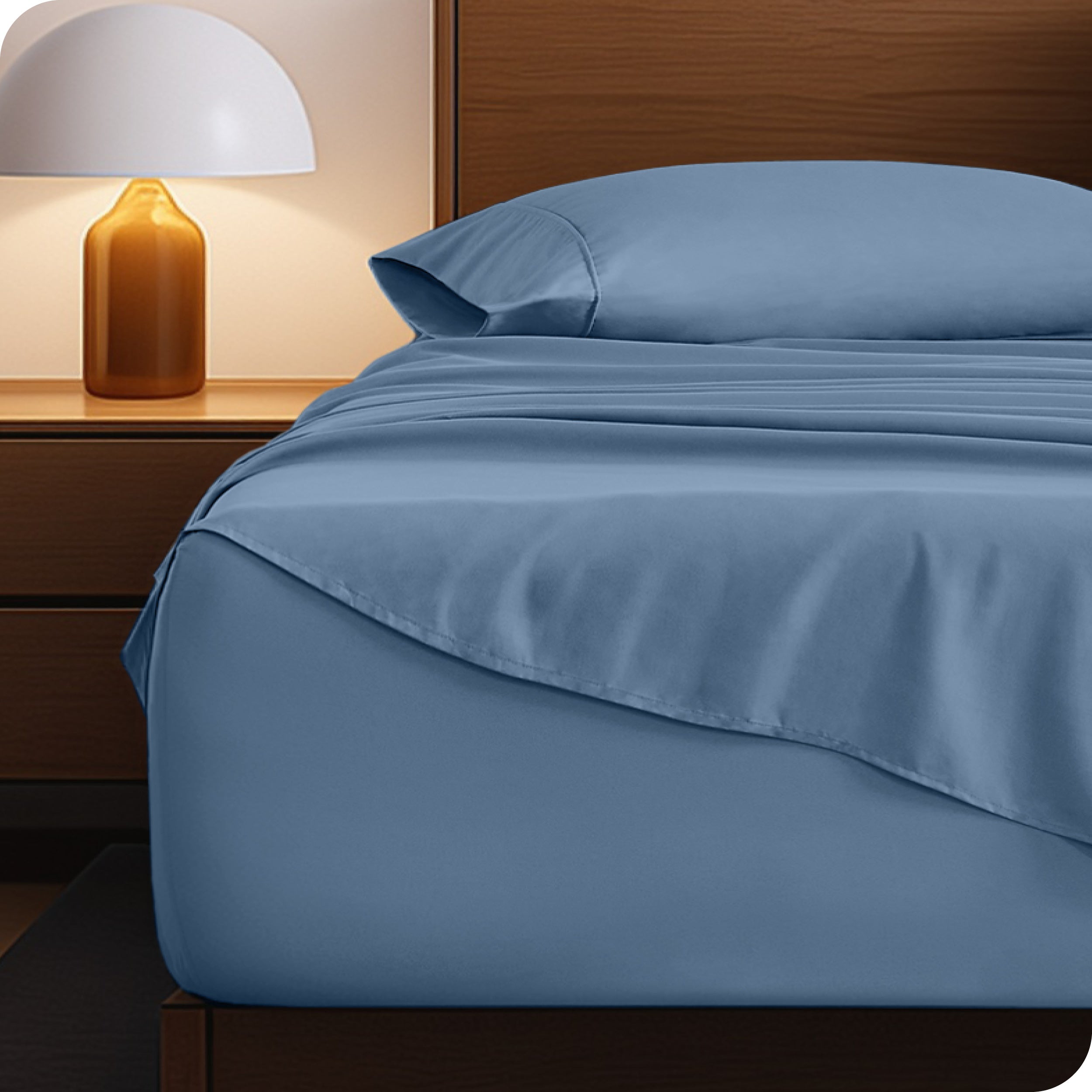 A cozy bedroom with a bed covered in soft microfiber sheets