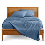 Microfiber sheet set on a bed with a wooden bed frame