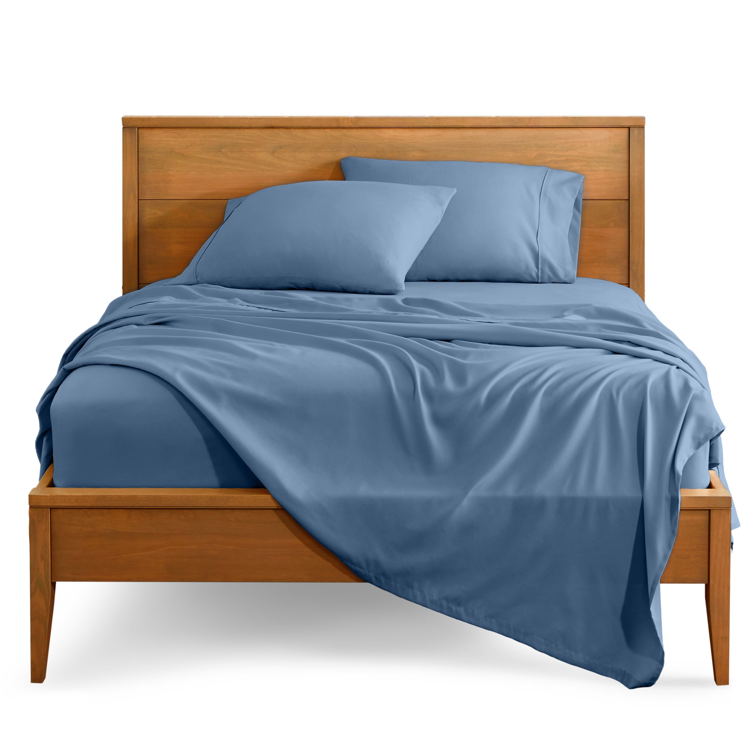 Microfiber sheet set on a bed with a wooden bed frame