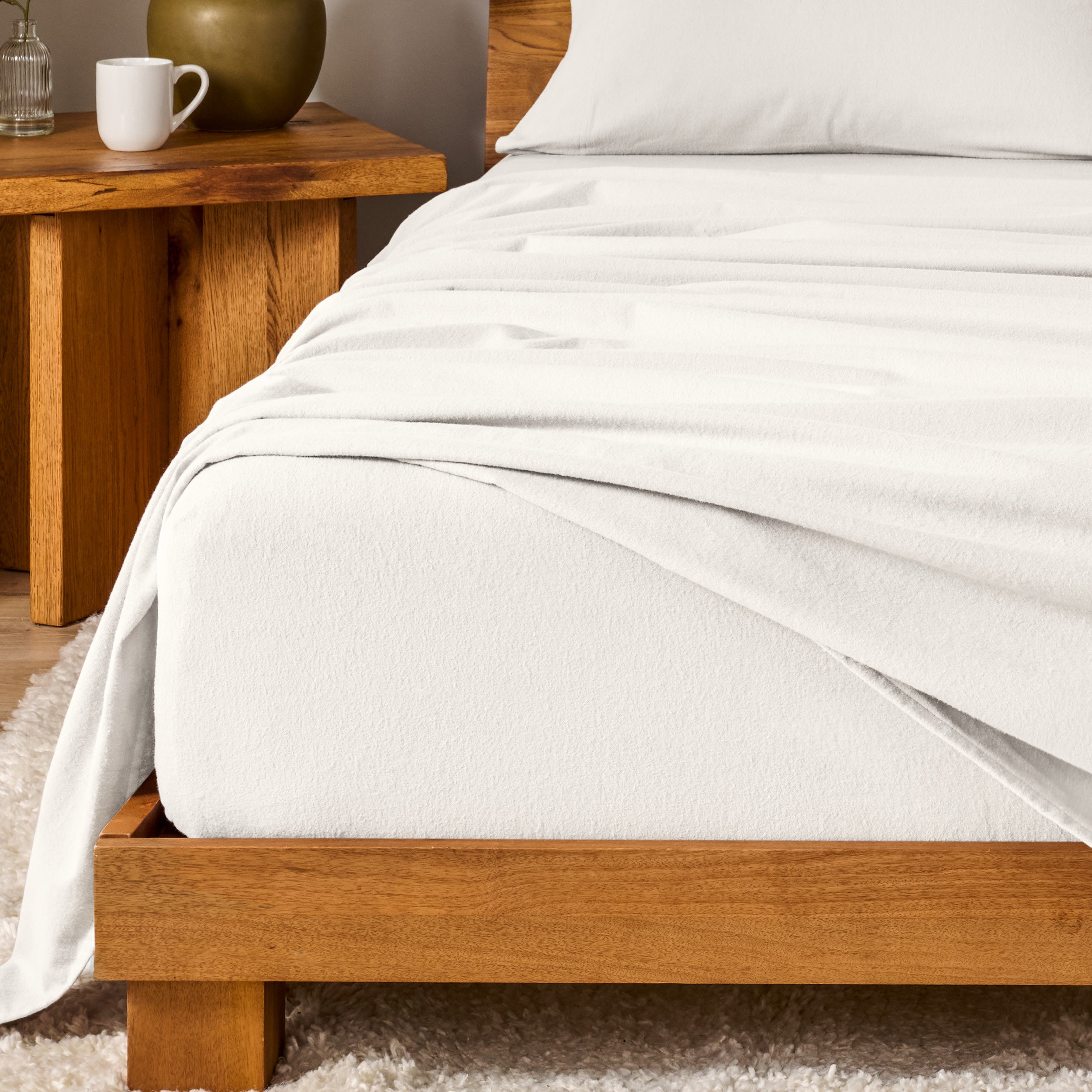 A modern bedroom with cotton flannel sheets on the bed