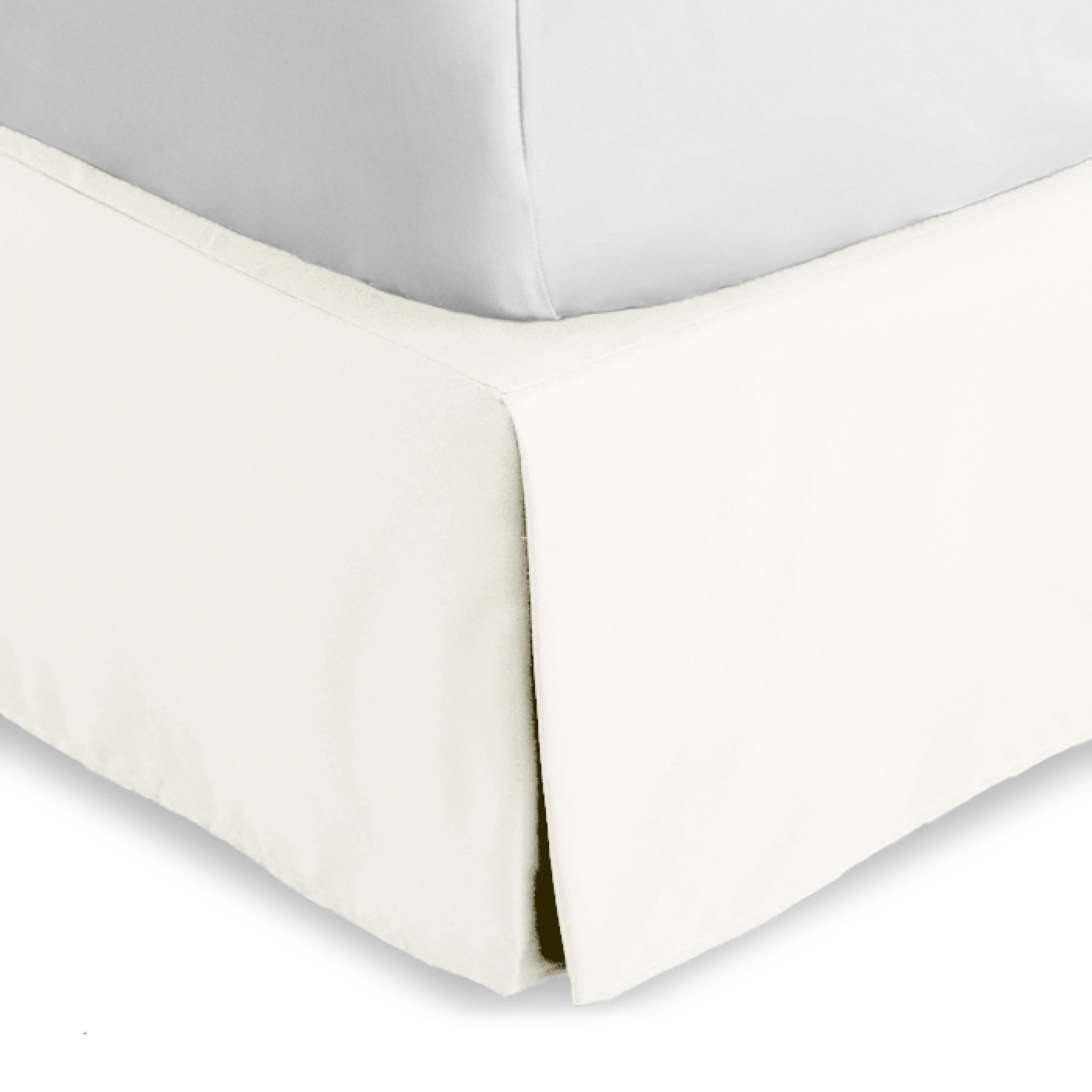 The corner of a bed skirt on a bed frame