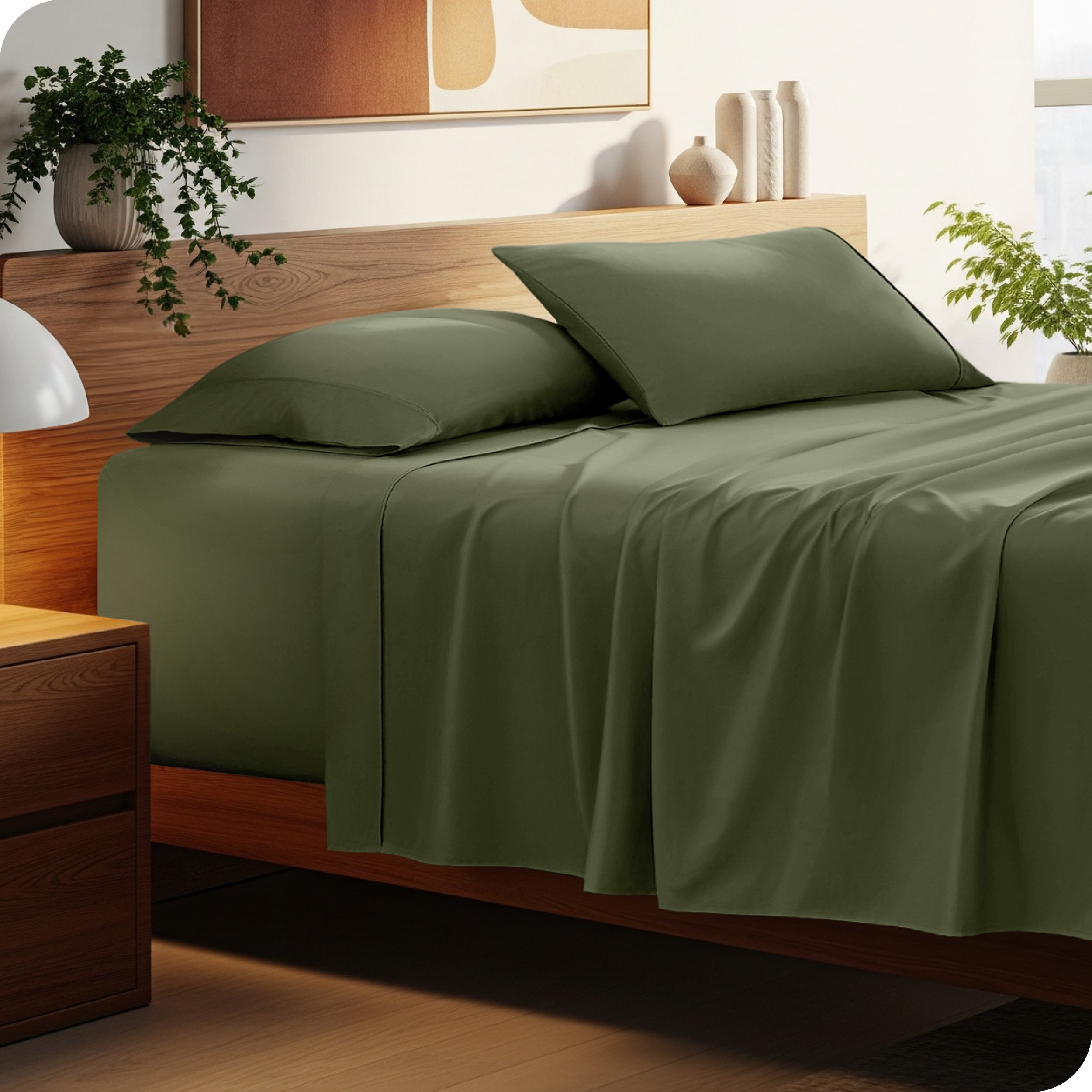 A cozy bedroom featuring a neatly made bed with soft, microfiber sheets