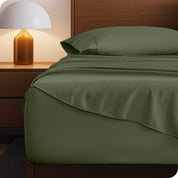 A cozy bedroom with a bed covered in soft microfiber sheets