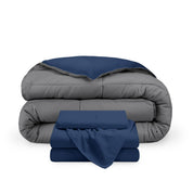 A reversible microfiber comforter and a coordinating sheet set folded and stacked