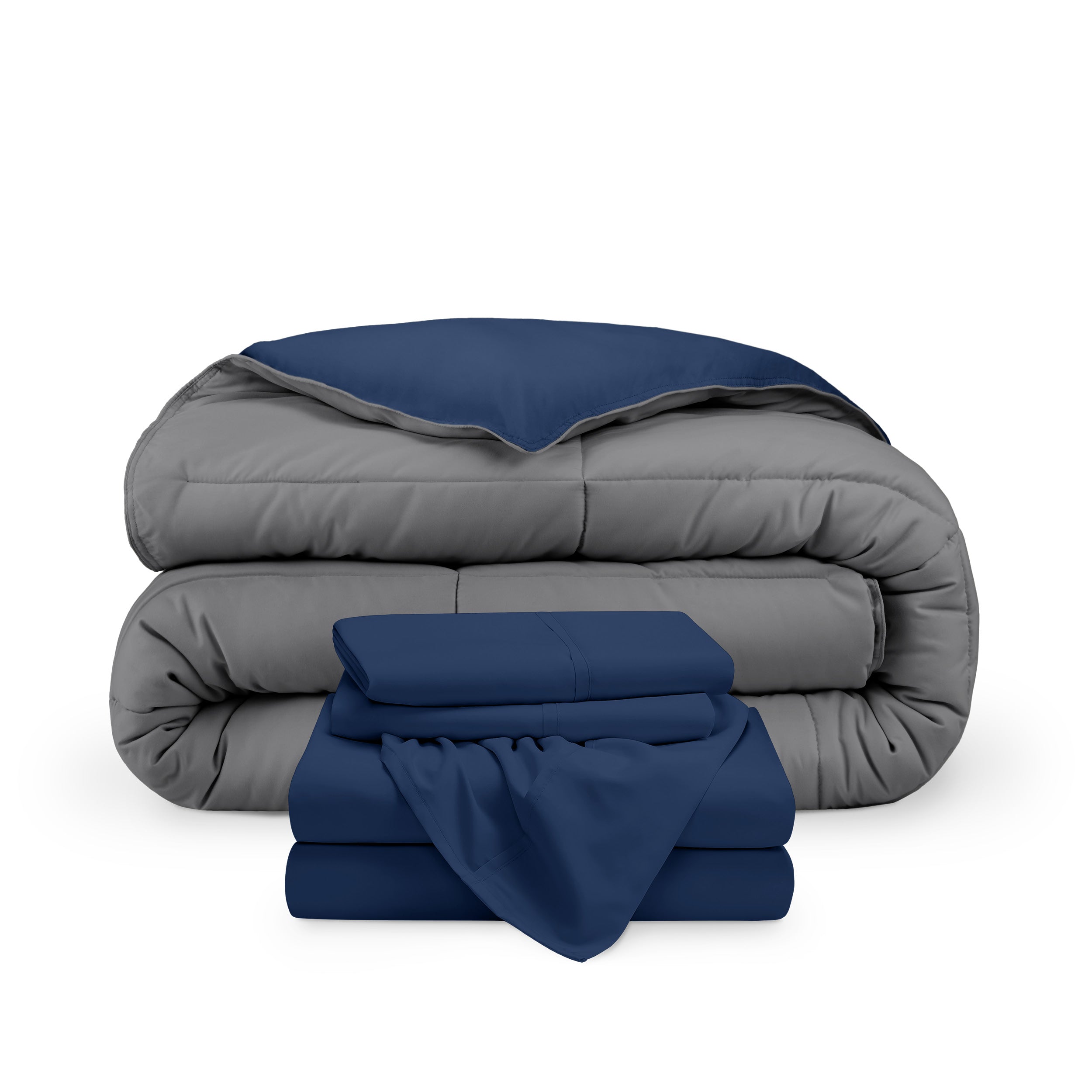 A reversible microfiber comforter and a coordinating sheet set folded and stacked