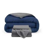 A reversible microfiber comforter and a coordinating sheet set folded and stacked