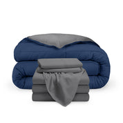 A reversible microfiber comforter and a coordinating sheet set folded and stacked