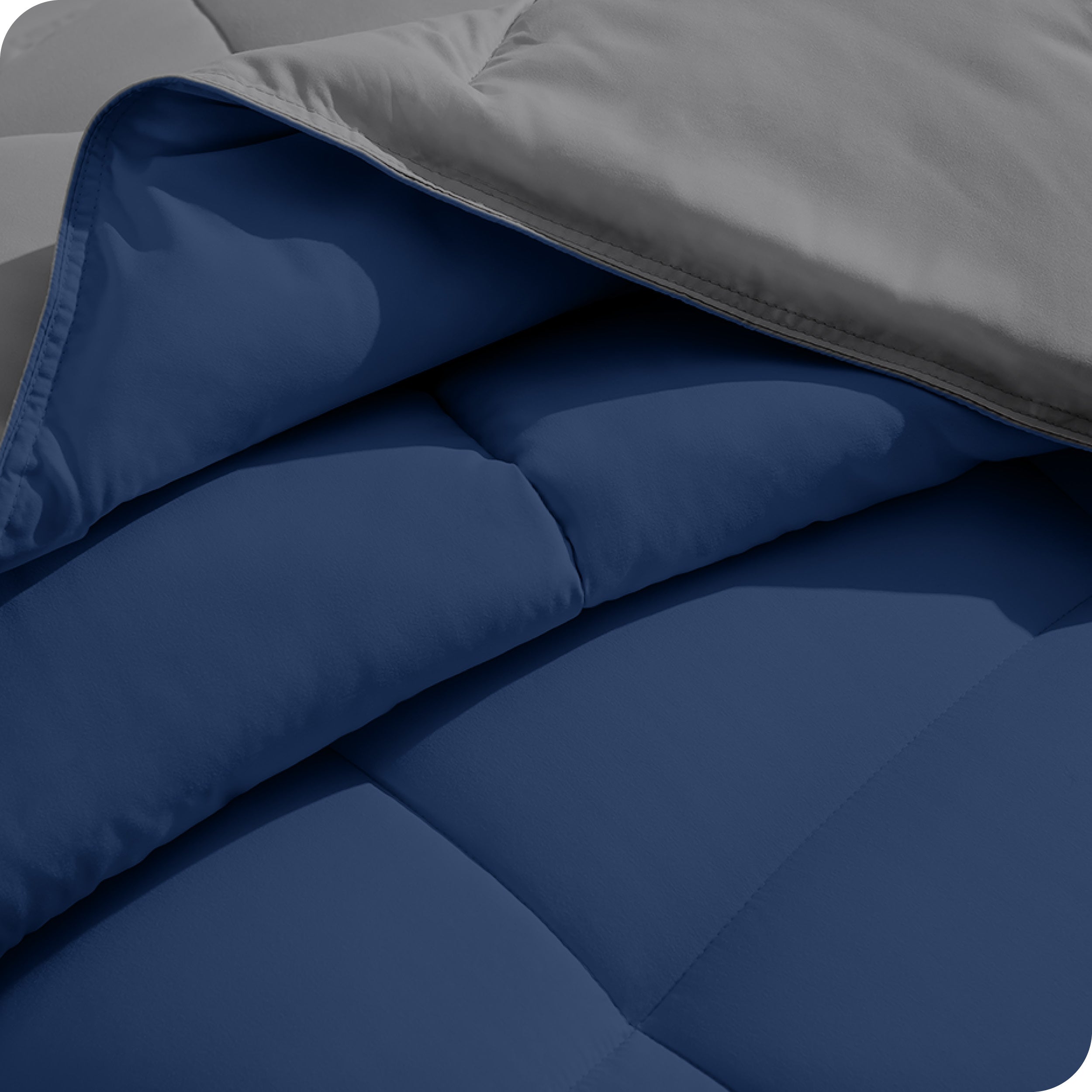Close up of the comforter folded back showing the two different colored sides.