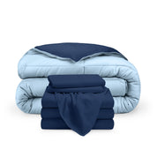 A reversible microfiber comforter and a coordinating sheet set folded and stacked